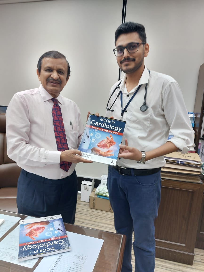 Presenting book to Dr C N Manjunath(Member of Parliament), then Director Jayadeva Institute, Bangalore (1000 bedded Cardiac Govt. Hospital), Bangalore