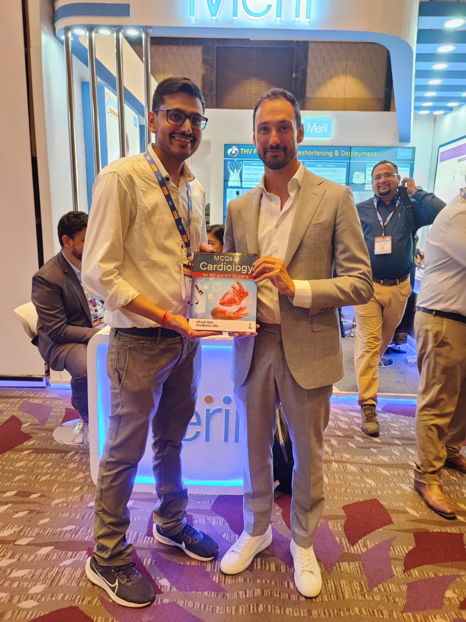 Presenting book to Dr Ignacio J Amat Santos, Director HCUV, Spain 